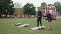 People-playing-cornhole-outside